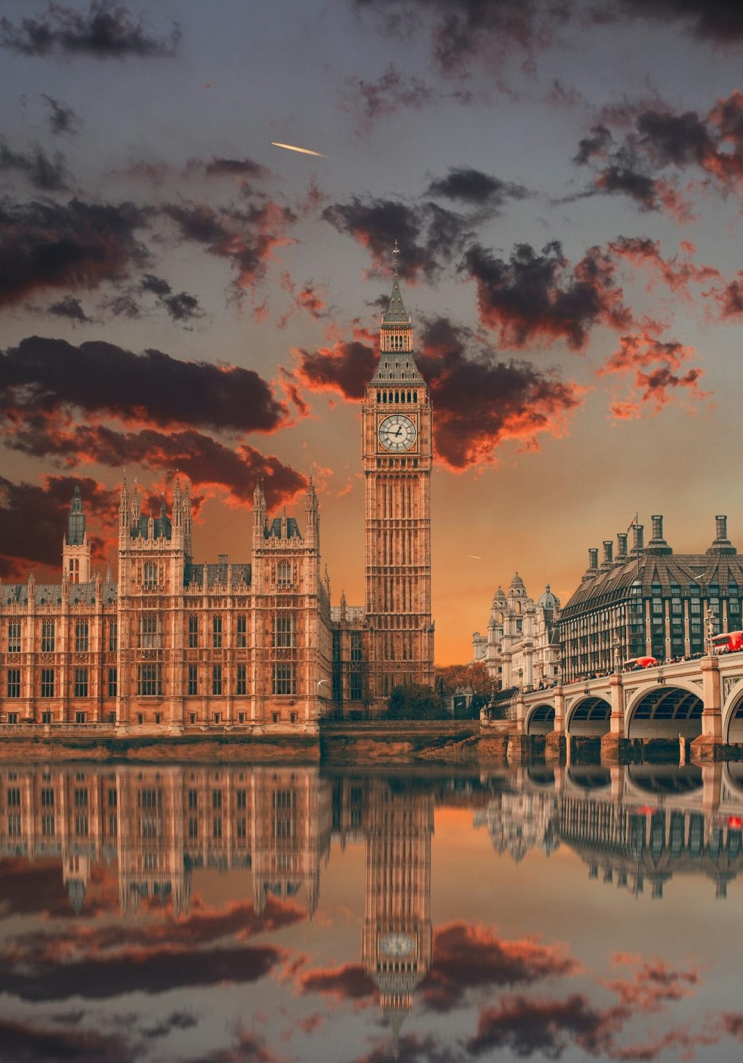 Big Ben reflected in water in a beautiful sunset London England