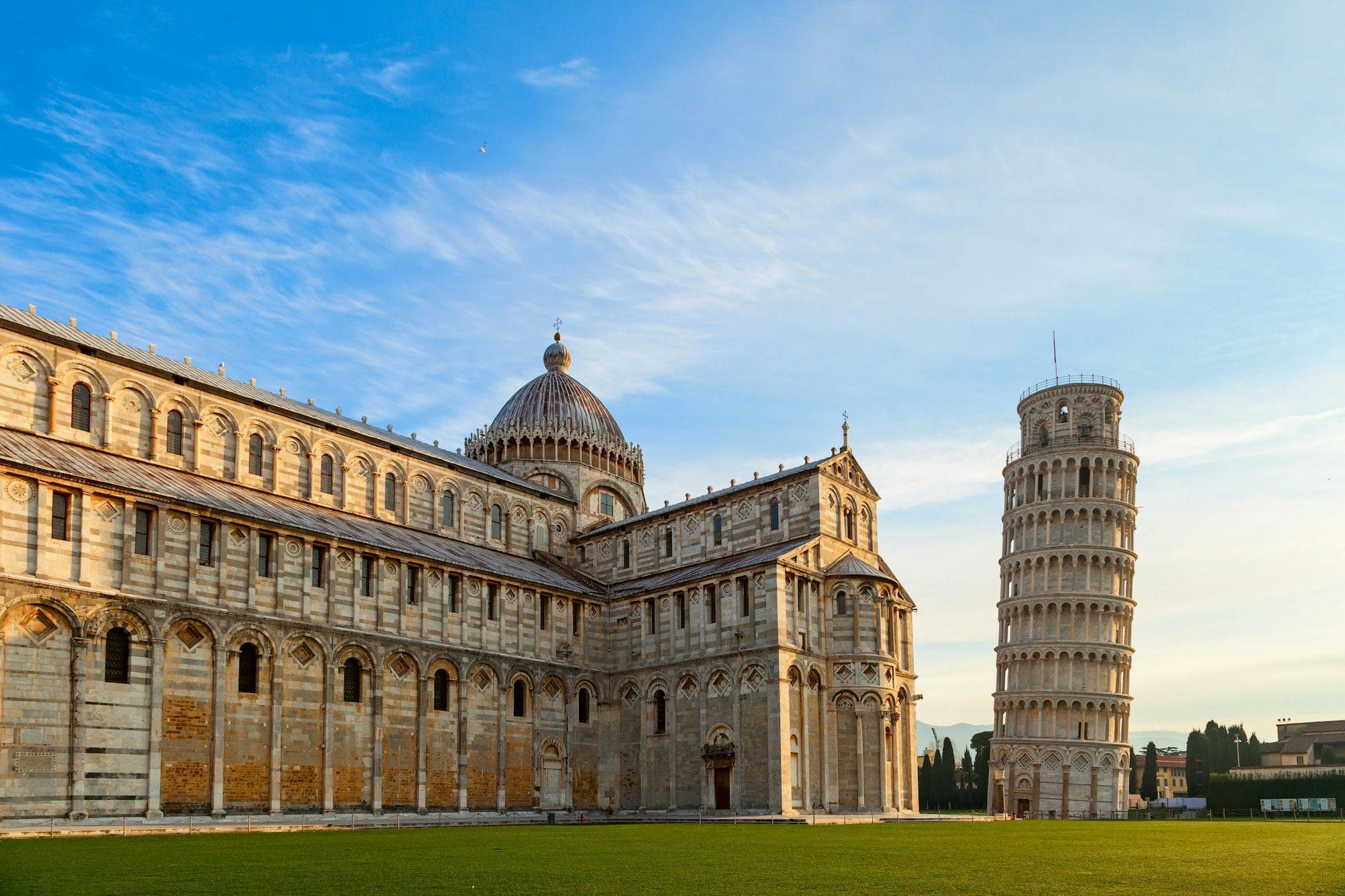 Scenic view of the Leaning Tower of Pisa and Pisa Cathedral in Italy on a sunny day